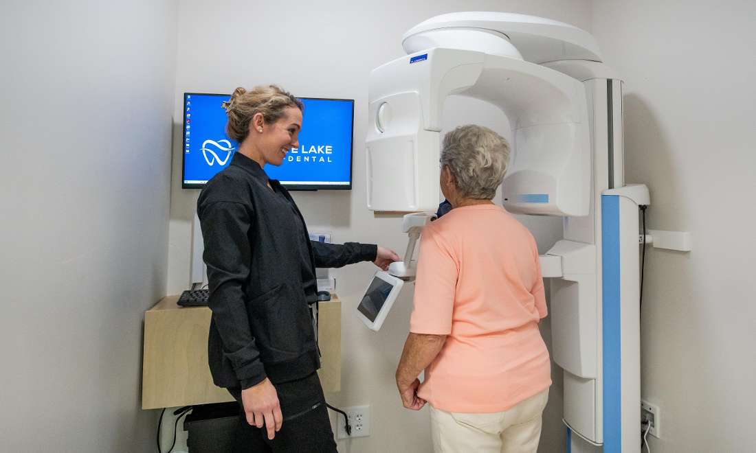 Patient receiving state of the art dental x-rays from a caring team member
