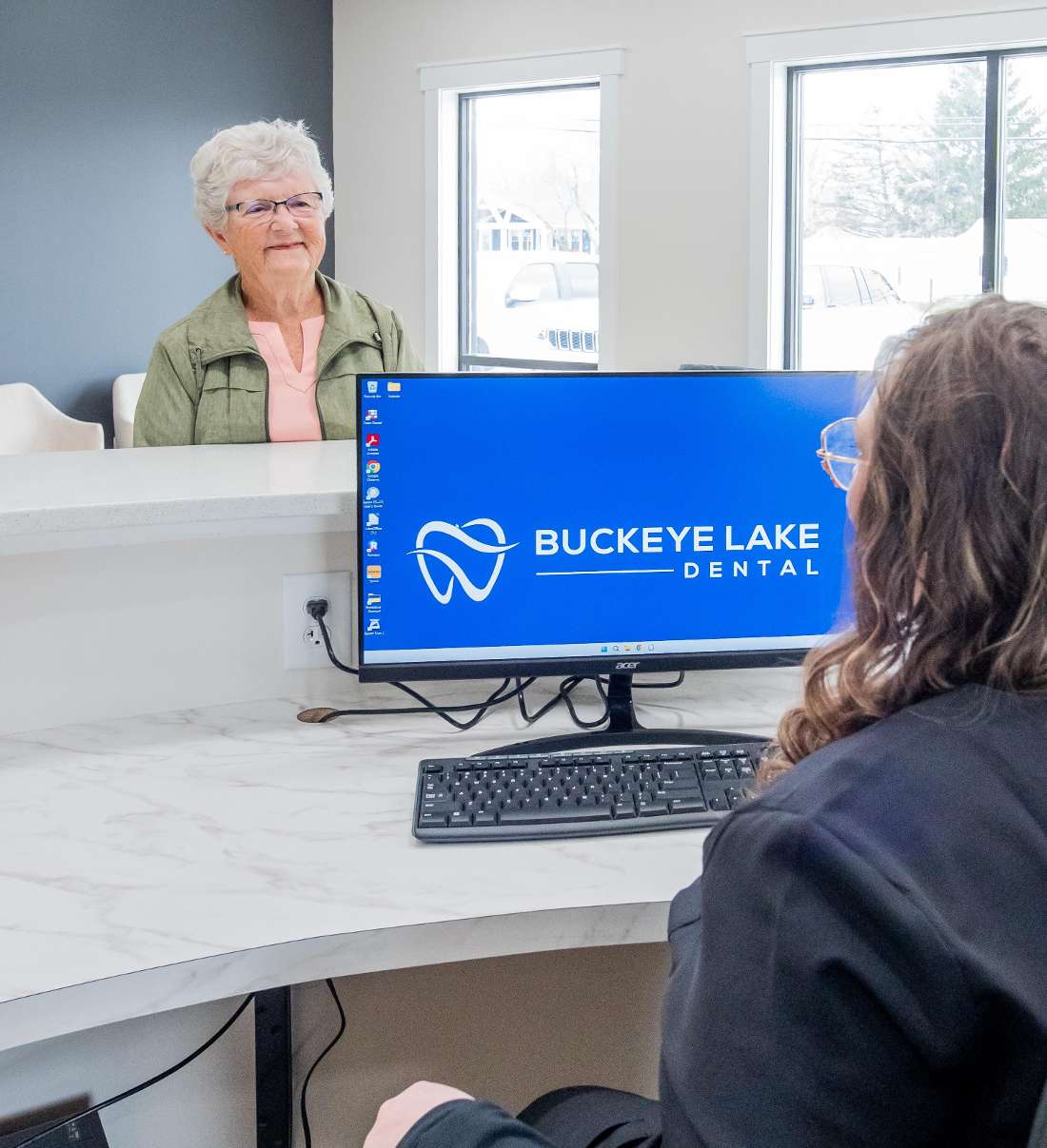Patient smiling at the efficient and pleasant check in process