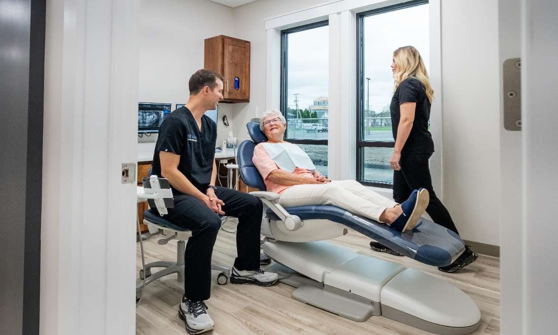 patient receiving excellent care from a kind and friendly dental team 